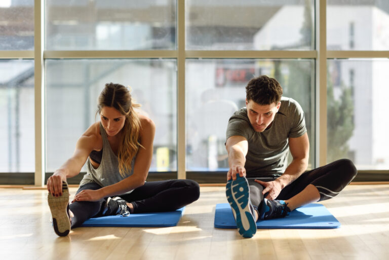 Couple exercising indoors