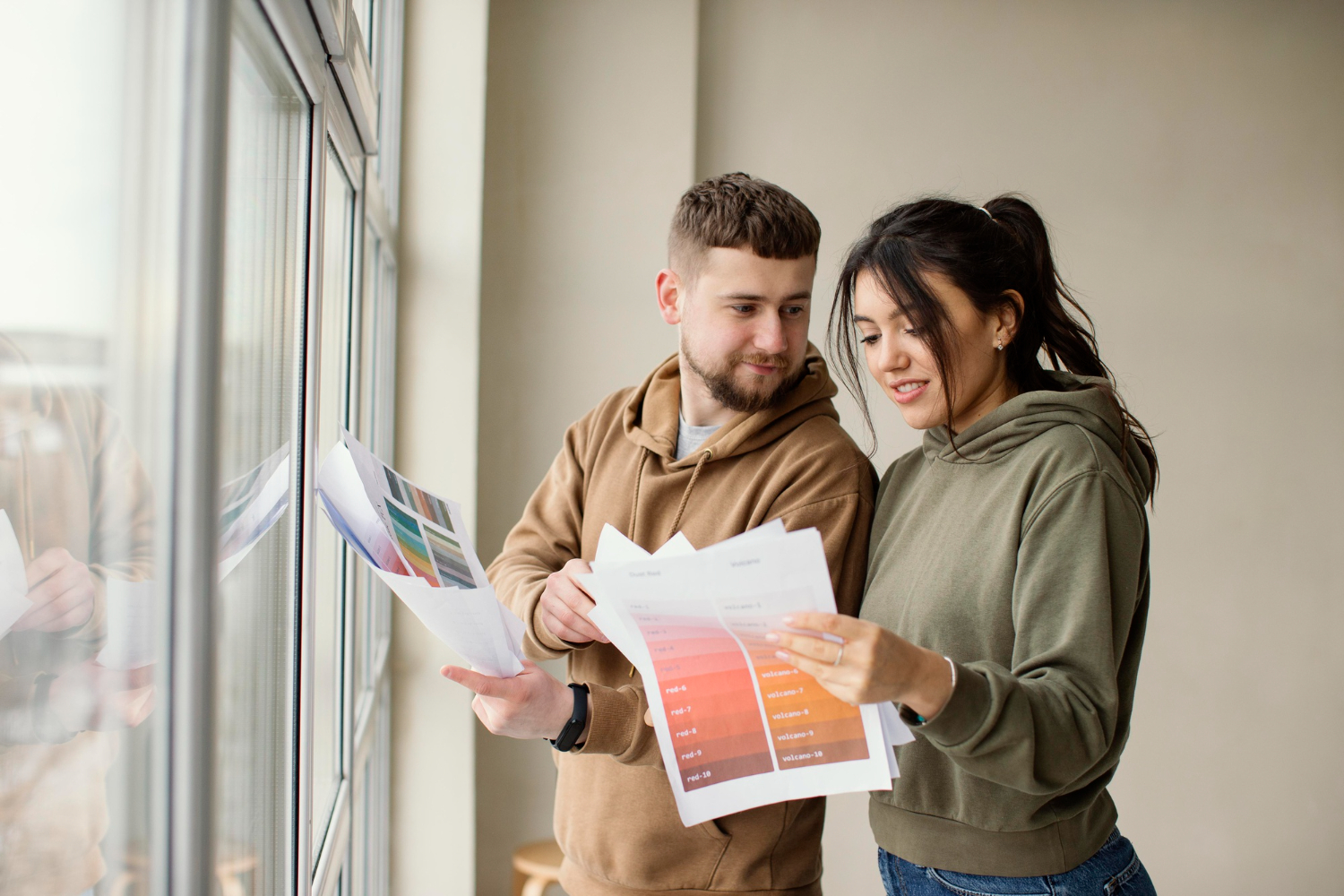 Couple looking through new home and considering options