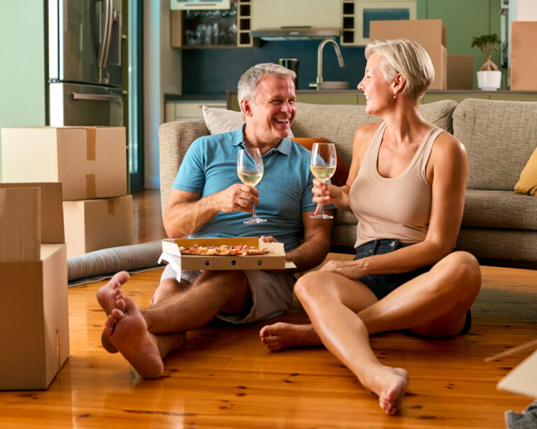 Couple moved into their new home and having a glass of wine